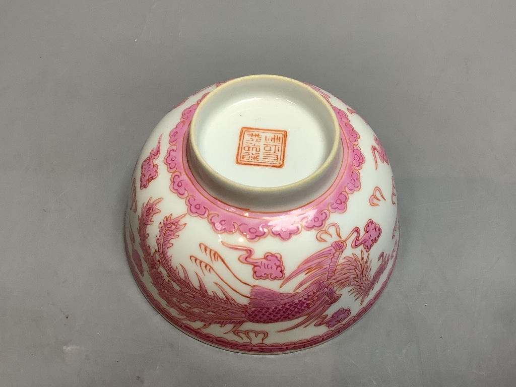 A Chinese pink enamelled 'dragon and phoenix' bowl, diameter 11cm